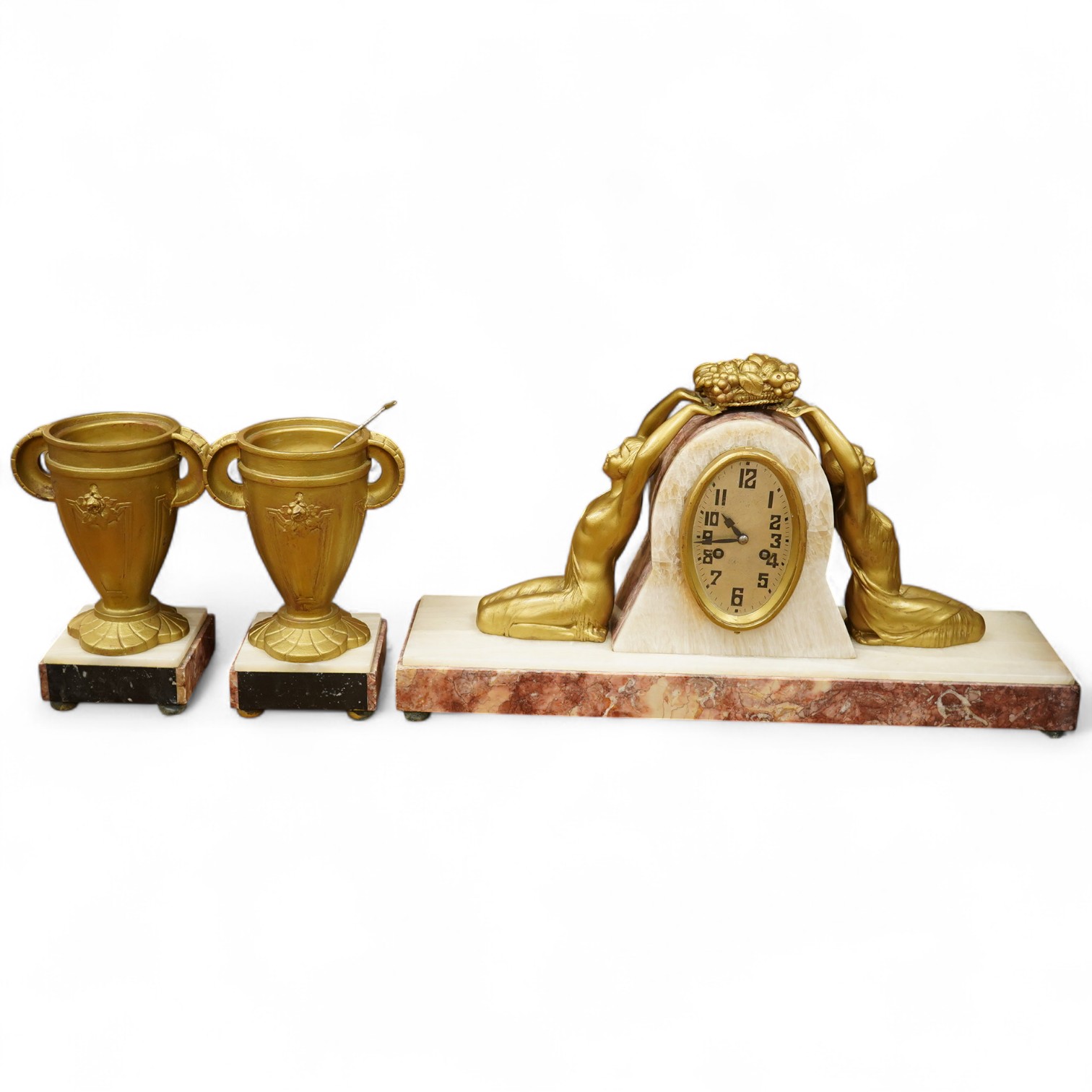 A French Art Deco figural and rouge marble clock garniture, 56cm wide. Condition - poor